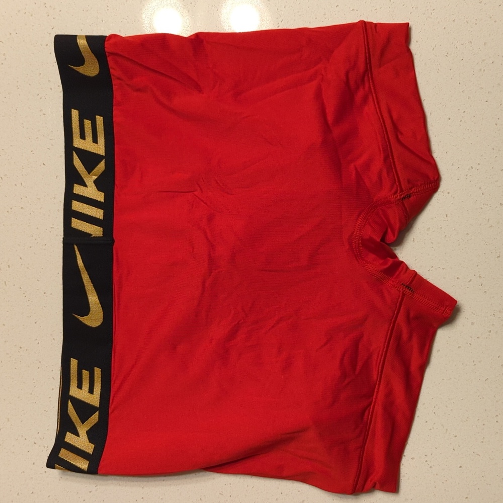 Nike Red Trunks with Gold Logo - Picture 2 of 2